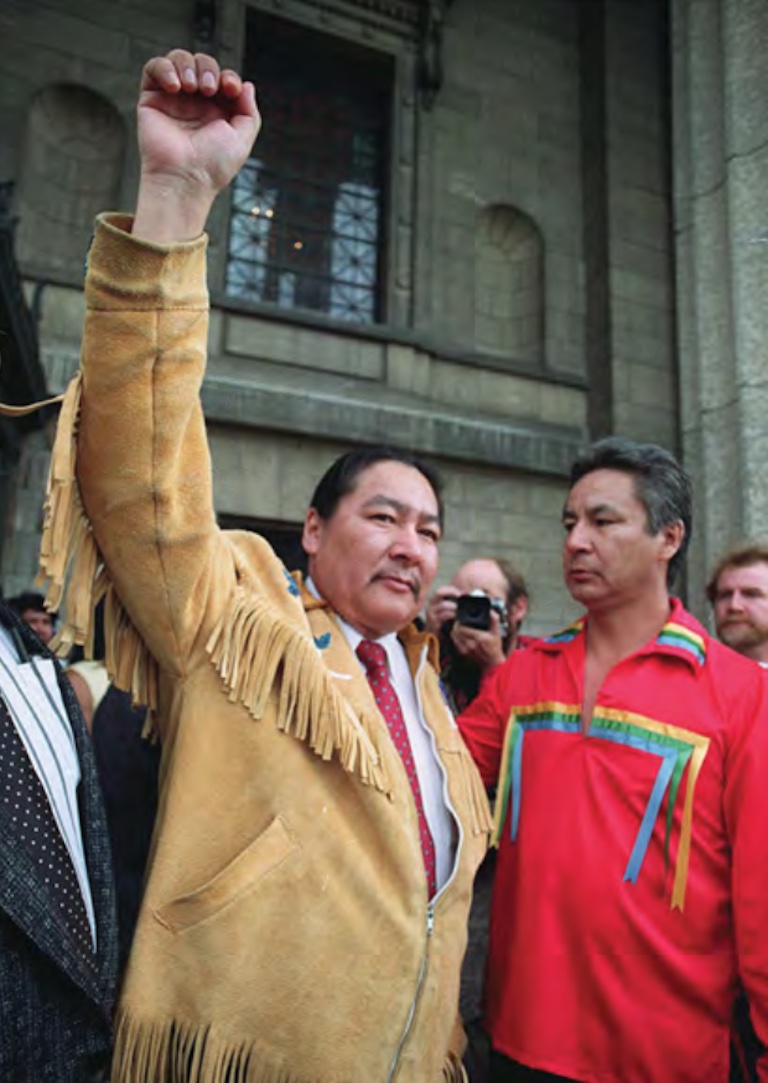 A man standing with his fist raised.