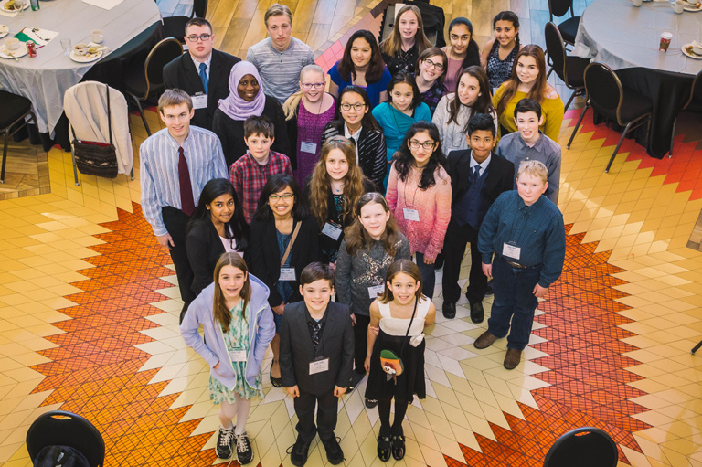 Twenty-six youth standing in the centre of room at Wabano Centre.